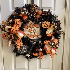 a halloween wreath on the front door