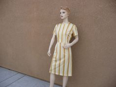 Vintage 1960's Stripped Dress ~ Zips In Back, Short Sleeves, Gold, White And Yellow Dress ~ No Belt Otherwise in Great Condition I will mail your package Priority Mail and First Class International. Measurements ~ Says Size 14 But Seems Like a Medium Bust 36 Inch Waist 28 Inch Hips 36 Inch Length Of Dress 41 Inch Vintage Striped Fitted Dress, Retro Fitted Dress With Vertical Stripes, Fitted Retro Dresses With Vertical Stripes, White And Yellow Dress, Stripped Dress, Sun City, 60s Fashion, Vintage Clothes, Dress Clothes For Women