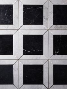 black and white marble tiles with squares on them