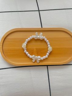 It's an elegant pearl bracelet with rose and bow charms perfect for Valentine's Day, if you have any questions let me know! :) Summer Jewlery, Crown Bracelet, Pearl Crown, Bracelet Craft Diy, Bow Bracelet, Bracelet Diy, Bracelet Ideas, Bracelet Crafts, Jewelry Inspo