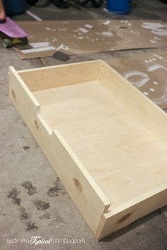 a wooden box sitting on top of a floor