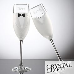 two champagne flutes with bow ties on each one are sitting side - by - side