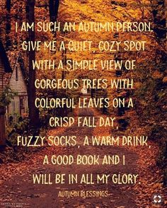 an autumn poem written in green and orange on a path surrounded by trees with yellow leaves