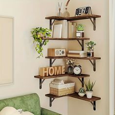 the shelves are filled with books, plants and other things to put on it's wall