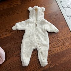 Brand New Never Worn Zip Onesie. Perfect For Cooler Weather. Teddy Bear Hood Cozy Hooded White Onesie, Cozy White Hooded Onesie, Cute White Onesie For Winter, Cute White Winter Onesie, White Winter Outerwear For Playwear, White Winter Playwear For Babies, Cooler Weather, Onesies, Kids Shop