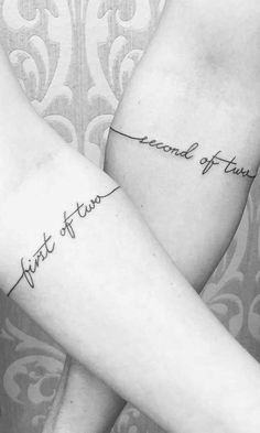 two people with matching tattoos on their arms, one has the word trust and the other says