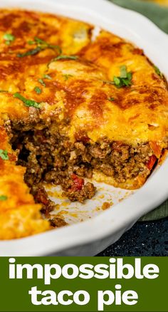 a close up of a casserole on a plate with the words impossible taco pie