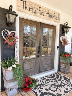 a couple of doors that are on the side of a building with potted plants