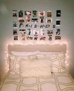 a white bed topped with lots of pictures and lights