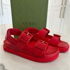 Brand New In Box. 100% Authentic Gucci Gg Dad Sandals Size 36 Style 660243 J8700 6549 Color -Maple Red Awesome Gucci Sandals With Mini Double G In Same Color. Adjustable Velcro Back And Two Buckles On Top. Rubber Comes Exactly As Shown In Photos. Includes Box, Dustbags And Papers Gucci Sandals With Buckle Closure For Summer, Modern Gucci Sandals For Summer, Designer Sandals With Red Sole And Round Toe, Gucci Designer Sandals With Red Sole, Gucci Leather Sandals With Red Sole, Modern Gucci Sandals With Round Toe, Flat Gucci Sandals With Red Sole, Gucci Red Round Toe Sandals, Designer Flat Sandals With Red Sole