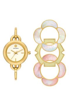 Stacked double-T logos punctuate a slender bangle watch that can be taken up a notch with three interchangeable, flower-shaped top rings in an array of shapes and colors. 27mm case; 5mm band width Includes watch and three interchangeable top rings Quartz movement Mineral crystal face Stainless steel with goldtone plate/mother-of-pearl/epoxy Imported Zodiac Watches, Womens Designer Watches, Watch Set, Bangle Watches, Watch Gift, Sneaker Dress Shoes, Top Rings, Stainless Steel Bangles, Analog Watch