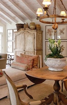 a living room filled with furniture and a wooden table