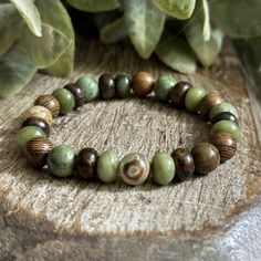 June's bracelet is here!
Abundant Earth. Designed with 8mm natural gemstones. Each piece, handmade. 
☀️ Enjoy 25% Off June's bracelet for a limited time. Available in sizes 6 1/4" through 9 1/4". 

"I firmly believe that nature brings solace in all troubles." ~ Anne Frank
~ Serpentine ~ Bronzite ~ Green Opal ~ Robles Wood ~ DZI Evil Eye Agate Nature-inspired Beaded Bracelets For Healing, Earthy Green Bracelets For Meditation, Earthy Green Beaded Bracelets For Everyday, Nature-inspired Hand-strung Beaded Bracelets, Earthy Green Jewelry With 8mm Beads, Earthy Green Bracelet For Healing, Earthy Green Bracelets For Healing, Earthy Green Healing Bracelet, Adjustable Rustic Green Bracelets