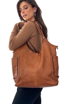 Bolsa Nova Italian Washed Leather Collection. Designed in NY, made in Florence, Italy. Features: Expertly fashioned from supple, vegetable-tanned leather, the Julia Slouchy Tote (Cognac) boasts two side open pockets adorned with elegant braided embellishments for a touch of bohemian flair. The roomy interior provides practical storage options with two open pockets and a zippered pocket to secure your essentials. Full top zip main closure. This versatile tote is the perfect choice for any occasio Elegant Leather Shoulder Bag With Pockets, Elegant Brown Shoulder Bag With Pockets, Slouchy Tote, Outfit Wedding Guest, Oxford Heels, Practical Storage, Platform Slippers, Leather Cleaning, Wallet Accessories