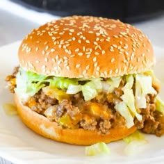 a close up of a hamburger on a plate