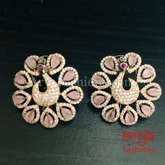 Rose Gold CZ Peacock Designer Studs with Multicolor Kemp Stones Made in Brass in Rose Gold finish with very high quality Cubic Zirconia Stones and Kemp Stones Length: Approx. 1.5" Light-weight Earrings Earrings come with Push Back Closure and Clip-On Suitable for any traditional for contemporary attire and occasion In-stock & ready-to-ship **Color may vary slightly due to photography and lighting. Gold Peacock Design Round Earrings, Luxury Multi-stone Fusion Earrings, Luxury Gold Earrings With Peacock Design, Luxury Traditional Multi-stone Earrings, Peacock Studs Gold, Light Weight Earrings, Cz Stone, Gold Finish, Mint Green