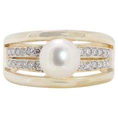 This exquisite 18K yellow gold ring showcases a lustrous 7.06MM Akoya pearl with a beautiful pink white hue. Surrounding the central pearl are 24 round brilliant diamonds, boasting a total carat weight of 0.29ct, F color grade, and VS clarity, adding a sparkling accent to the elegant design. Weighing 7.03 grams, this luxurious ring is sized at 53.5/14.5. A perfect blend of classic beauty and modern sophistication, this ring is a stunning addition to any fine jewelry collection. Metal: 18K Yellow Luxury Yellow Gold Stackable Pearl Ring, Luxury Yellow Gold Pearl Ring With Round Cut, Luxury Yellow Gold Pearl Ring With Diamond Accents, Luxury Modern Yellow Gold Pearl Ring, Luxury Yellow Gold Pearl Ring With Single Diamond, Luxury Everyday Yellow Gold Pearl Ring, Luxury Timeless Pearl Ring With Diamond Accents, Luxury Yellow Gold Pearl Ring For Everyday, Yellow Gold Pearl Ring With High Luster