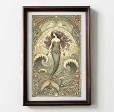 a framed art print of a mermaid with long hair