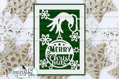 a christmas card with snowflakes on it and merry ornament in the background