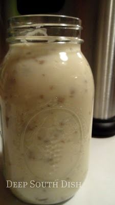 a jar filled with liquid sitting on top of a counter