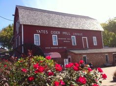 a red building with flowers in front of it