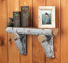 a couple of shelves with candles and pictures on them