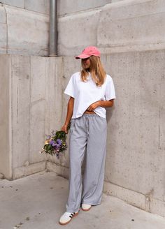 Grey striped pajama-style, wide-leg pants/trousers that feature an elastic waist in addition to a bow to tie. These comfortable pants can be worn low rise if that suits your style, they also do not offer lining but they are not sheer. Our model also wears the White Jane T-Shirt. One size (fits from US 2-4-6-8) Length 39.37 in - Width 12.60 in 80% Cotton - 20% Polyester Washing: 86°F handwash Casual Striped Wide Leg Pants With Relaxed Fit, Casual Striped Ankle-length Wide Leg Pants, Casual Striped Wide Leg Loungewear Pants, Striped Ankle-length Loungewear Pants, Casual Striped Wide Leg Lounge Pants, Chic Striped Wide Leg Pants For Loungewear, Chic Striped Wide Leg Pants With Relaxed Fit, Chic Striped Wide Leg Pants, Striped Wide Leg Pants For Loungewear