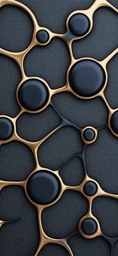 some black and gold shapes on a surface