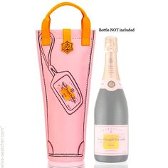 a bottle of wine next to a pink bag