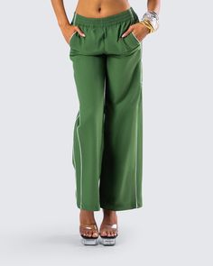 Even though it’s not a race, you’ll still take first place in these green track pants 😜 Perfect for dressing up or down, these pants are made from high quality ripstop fabric and complete with a relaxed fit, double piping on both sides, and side pockets 💚 Casual Green Pants With Elastic Side Panels, Sporty Green Pants With Elastic Side Panels, Sporty Green Parachute Pants With Side Pockets, Green Wide-leg Parachute Pants With Elastic Waistband, Green Wide Leg Parachute Pants With Side Pockets, Green Wide-leg Parachute Pants, Green Wide-leg Sweatpants With Elastic Waistband, Green Sporty Pants With Side Pockets, Sporty Green Pants With Side Pockets