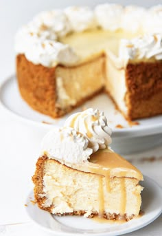 a slice of cheesecake on a plate with the rest of the cake in the background