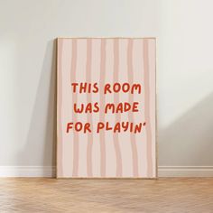 this room was made for playin'print in pink and red on a white wall