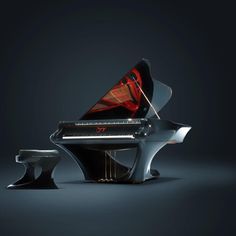 a black piano sitting on top of a table