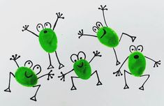 four green children's handprints with faces and hands in the shape of frogs