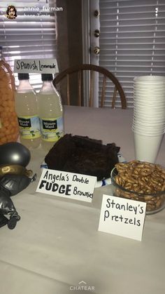 a table topped with lots of different types of food and drinks on top of it