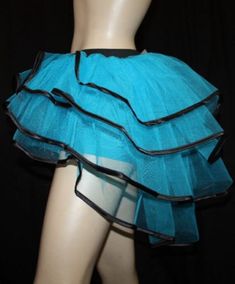 a mannequin wearing a blue skirt with black trim