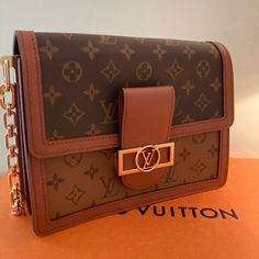 New Never Used Louis Vuitton Bag Authentic New Collection Designer Shoulder Bag With Chain For Travel, Designer Chain Shoulder Bag For Travel, Gold Monogram Canvas Shoulder Bag With Chain Strap, Brown Monogram Canvas Bag With Chain Strap, Travel Bag With Chain Strap And Monogram Canvas, Travel Shoulder Bag With Chain Strap And Monogram Canvas, Monogram Canvas Shoulder Bag With Chain Strap For Travel, Brown Monogram Canvas Shoulder Bag With Chain Strap, Rectangular Monogram Canvas Shoulder Bag With Chain Strap