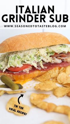 a close up of a sandwich and chips on a plate with the words italian grinder sub above it