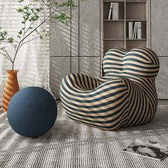 a living room filled with furniture next to a tall book shelf and window covered in blinds