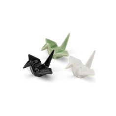 three small black and white origami birds