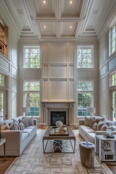 a large living room with high ceilings and windows