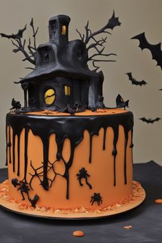 a halloween cake decorated with black icing and spooky decorations