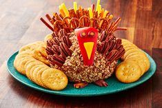 a turkey made out of crackers and pretzels on a plate