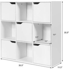 a white shelf with drawers and numbers on it