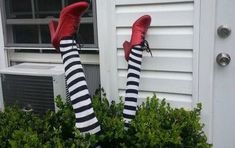 legs in striped socks and red shoes with the words how to make wiked witch legs