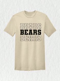 Introducing our latest addition to the team spirit collection - this awesome Bears Team Mascot Shirt!  Show off your love for the Bears with this spirited sport shirt that screams team pride and support. Whether you're a student, parent, or simply a devoted fan, this shirt is a must-have for anyone who wants to represent their favorite team in style. Designed with the iconic Bears mascot and team logo, this shirt showcases your unwavering support for the Bears. The vibrant colors and bold graphi School Spirit Graphic T-shirt Fan Gear, School Spirit Graphic T-shirt For Fan Gear, School Spirit Graphic Print T-shirt For Fan Gear, School Spirit Graphic T-shirt, Tri-blend Tops With Graphic Print For Sports Fans, Team-colored Graphic T-shirt For Game Day, Team-colored Graphic Print T-shirt For Game Day, School Spirit Graphic T-shirt For Sports Events, School Spirit Graphic Print T-shirt For Sports Events