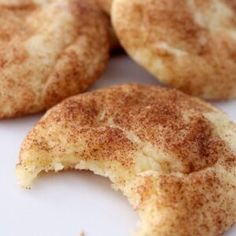 four cinnamon sugar cookies on a white plate