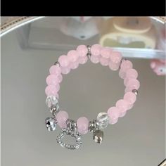 Pink Beaded, Bell And Charmed Hello Kitty Bracelet Hello Kitty Bracelet Ideas, Beaded Bracelets Charms, Pink Bead Bracelet Ideas, Cute Pink Bracelets With Dangling Charms, Karol G Bracelet, Pink And Purple Bracelet, Hello Kitty Bracelets, Bracelet Hello Kitty, Charm Bracelet Hello Kitty