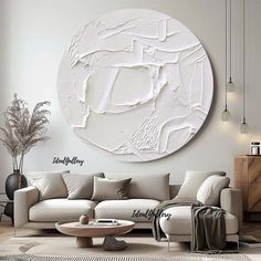 a living room filled with furniture and a large white circular wall art above the couch