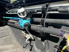 fishing rods and reels in the back of a car